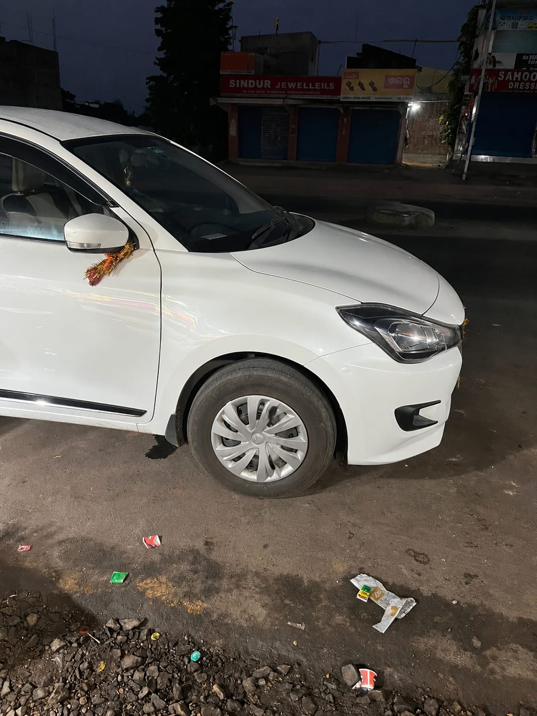 White sedan available for self drive car rental in Cuttack